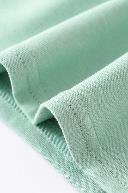 Green french knot farm ruffle dress
